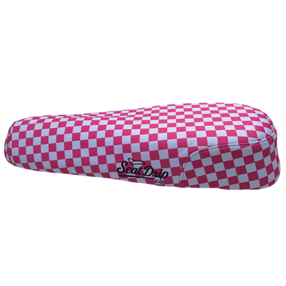 Bubblegum Checkered DiroDi Rover seat cover with bold style, soft neoprene, and bum protection for comfy, eye-catching rides.