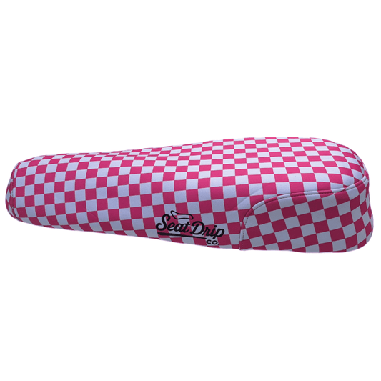 Bubblegum Checkered DiroDi Rover seat cover with bold style, soft neoprene, and bum protection for comfy, eye-catching rides.