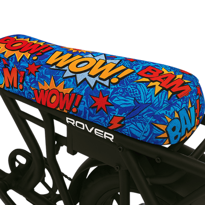 Comic Blast DiroDi Rover seat cover with vibrant comic-style graphics, soft neoprene, and bum protection for bold, comfy rides.
