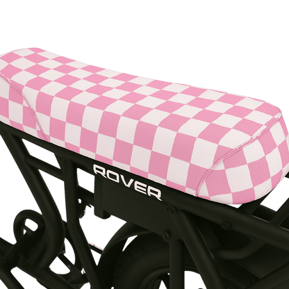 Bubblegum Checkered DiroDi Rover seat cover with bold style, soft neoprene, and bum protection for comfy, eye-catching rides.
